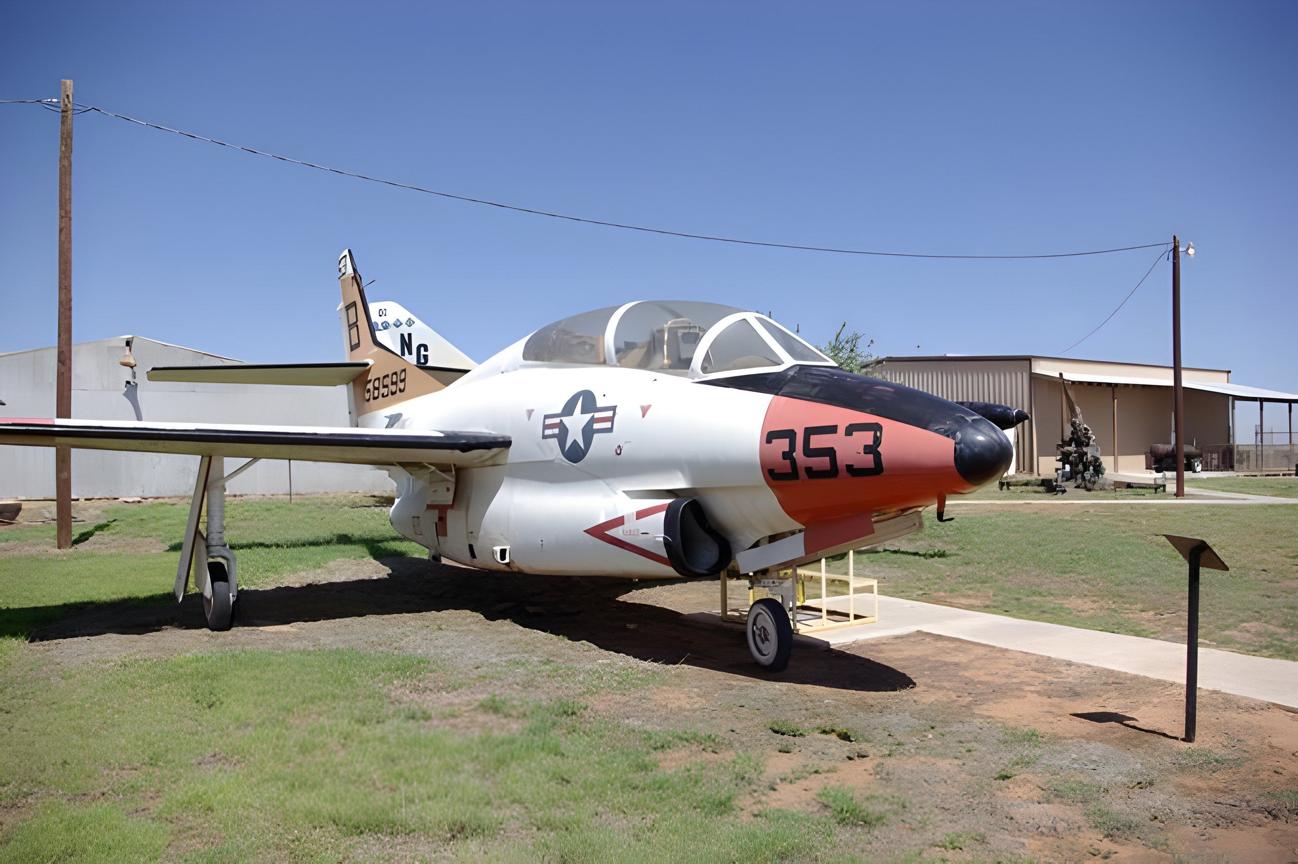 The yard at Texas Air Museum. Park where people walk.